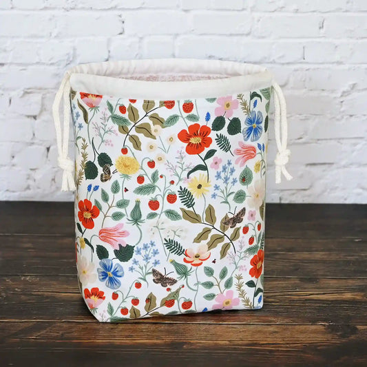 Small drawstring knitting bag with pockets.  Made from Rifle Paper Co Strawberry Fields Fabric.  Made in Nova Scotia, Canada by Yellow Petal Handmade.