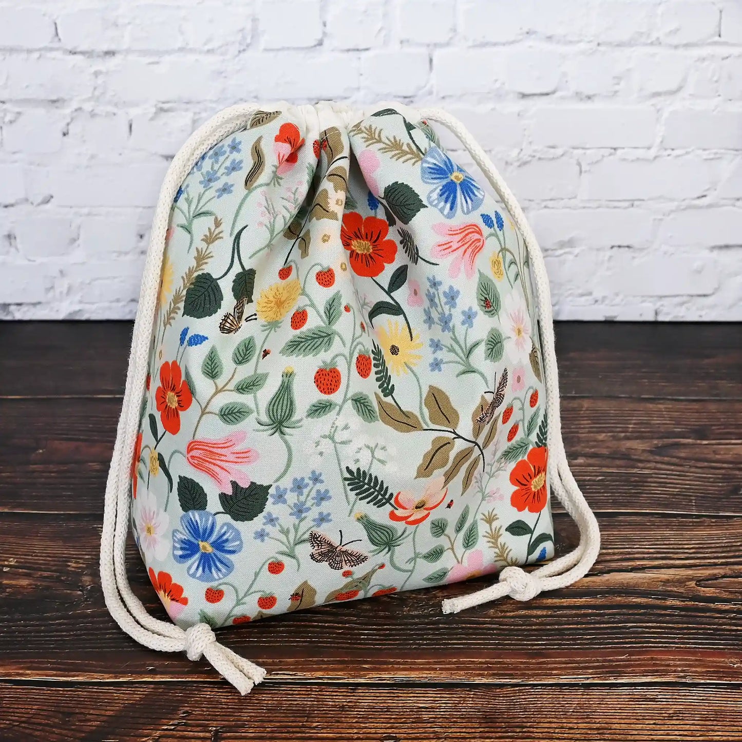 Pretty mint floral drawstring project bag made from Rifle Paper Co's Strawberry Fields Collection.  Lined in a delicate pink floral.  Made in Nova Scotia, Canada by Yellow Petal Handmade.