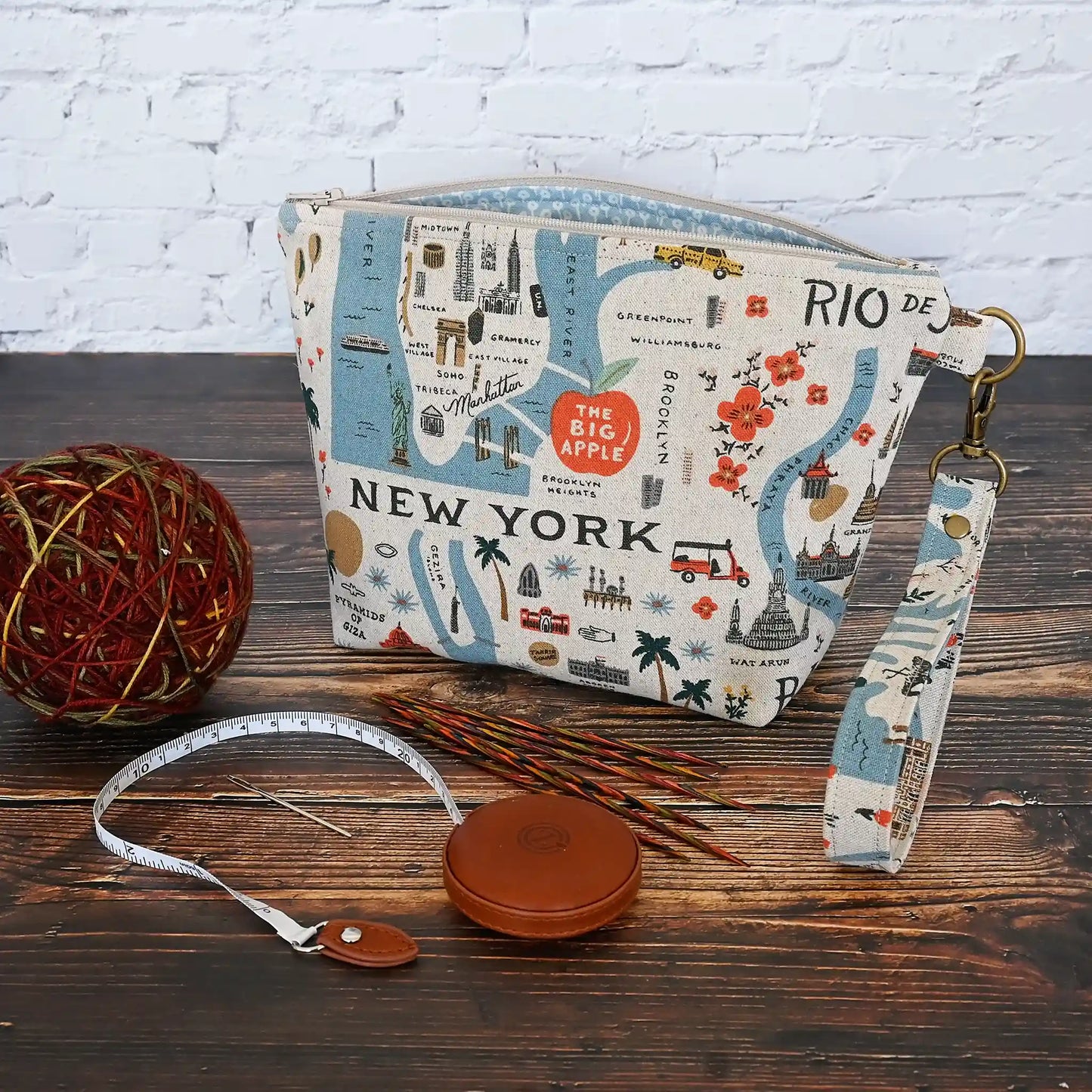 Adorable canvas travel sized project pouch made from Rifle Paper Co's Bon Voyage Collection.  Lined in a pretty blue floral, this pouch is a great size for on the go.  It comes with a removable wrist strap.  Made in Canada by Yellow Petal Handmade.