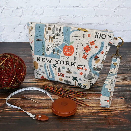 Adorable canvas travel sized project pouch made from Rifle Paper Co's Bon Voyage Collection.  Lined in a pretty blue floral, this pouch is a great size for on the go.  It comes with a removable wrist strap.  Made in Canada by Yellow Petal Handmade.
