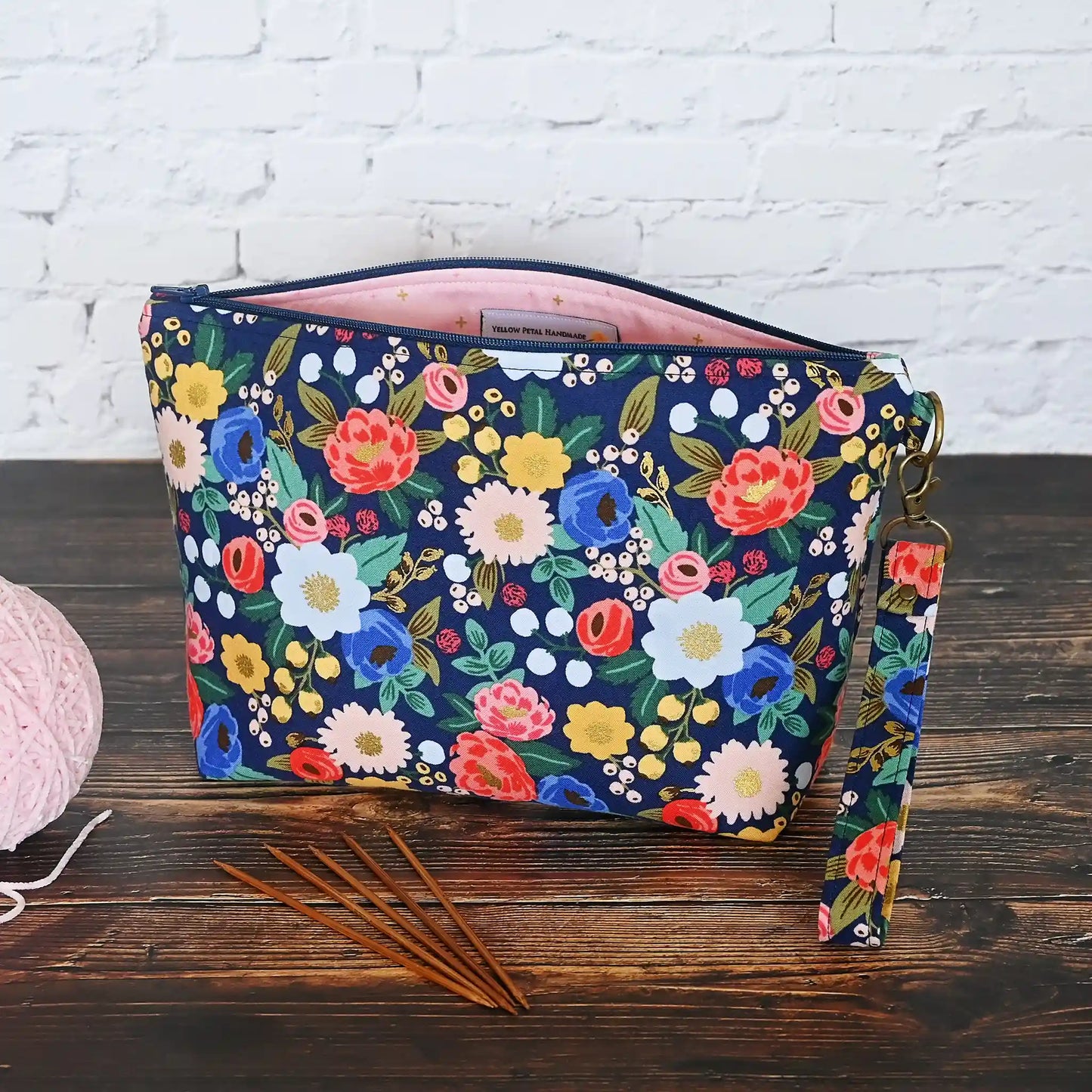 Pretty navy floral project bag with zipper and wrist strap.  Made from Rifle Paper Co's Antique Garden.  Made in Nova Scotia, Canada by Yellow Petal Handmade.