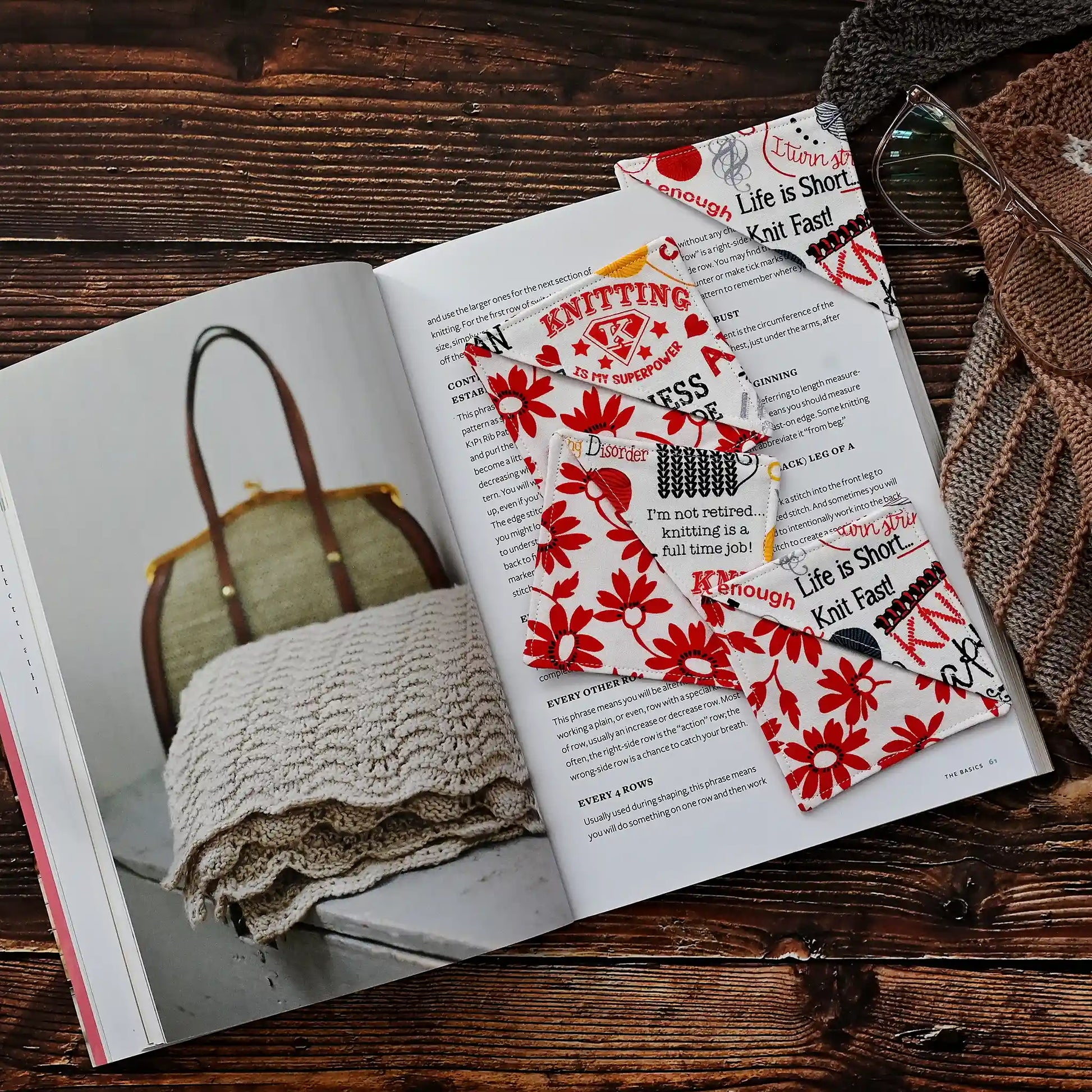 Fun red and white bookmarks for knitters.  Each features a saying for knitters on the corner and they have a red and white floral background.  Made in Canada by Yellow Petal Handmade.