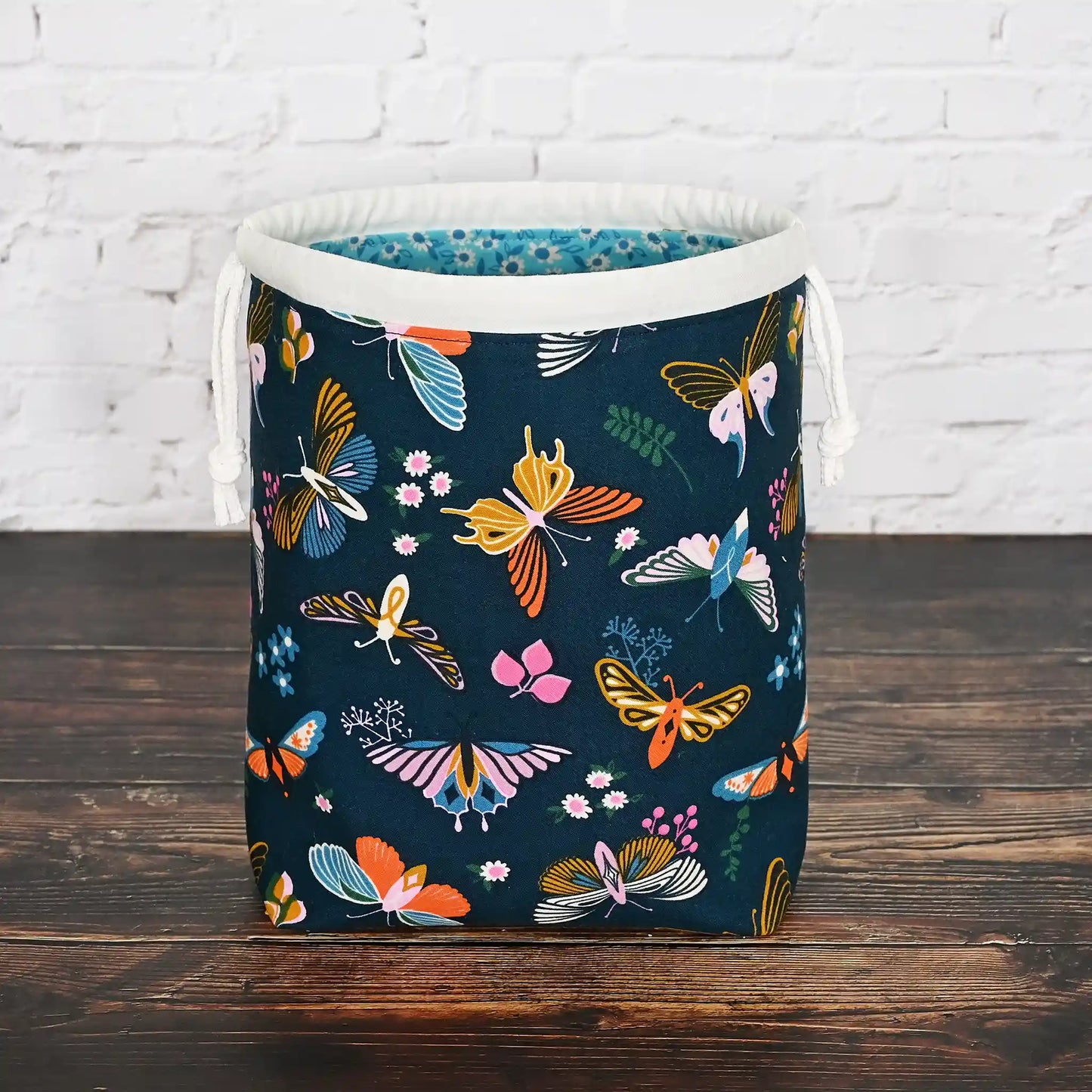 Beautiful butterfly themed drawstring project bag, lined in a pretty aqua floral and with pockets.  Made in Canada by Yellow Petal Handmade.