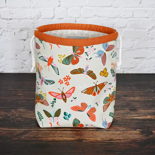 Beautiful butterfly themed drawstring project bag, lined in a pretty cream floral and with pockets.  Made in Canada by Yellow Petal Handmade.