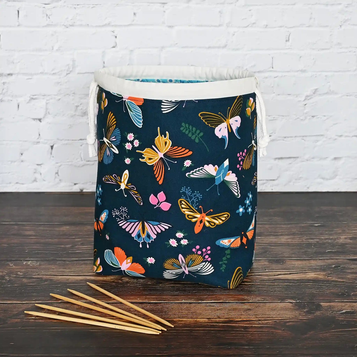 Beautiful butterfly themed drawstring project bag, lined in a pretty aqua floral and with pockets.  Made in Canada by Yellow Petal Handmade.