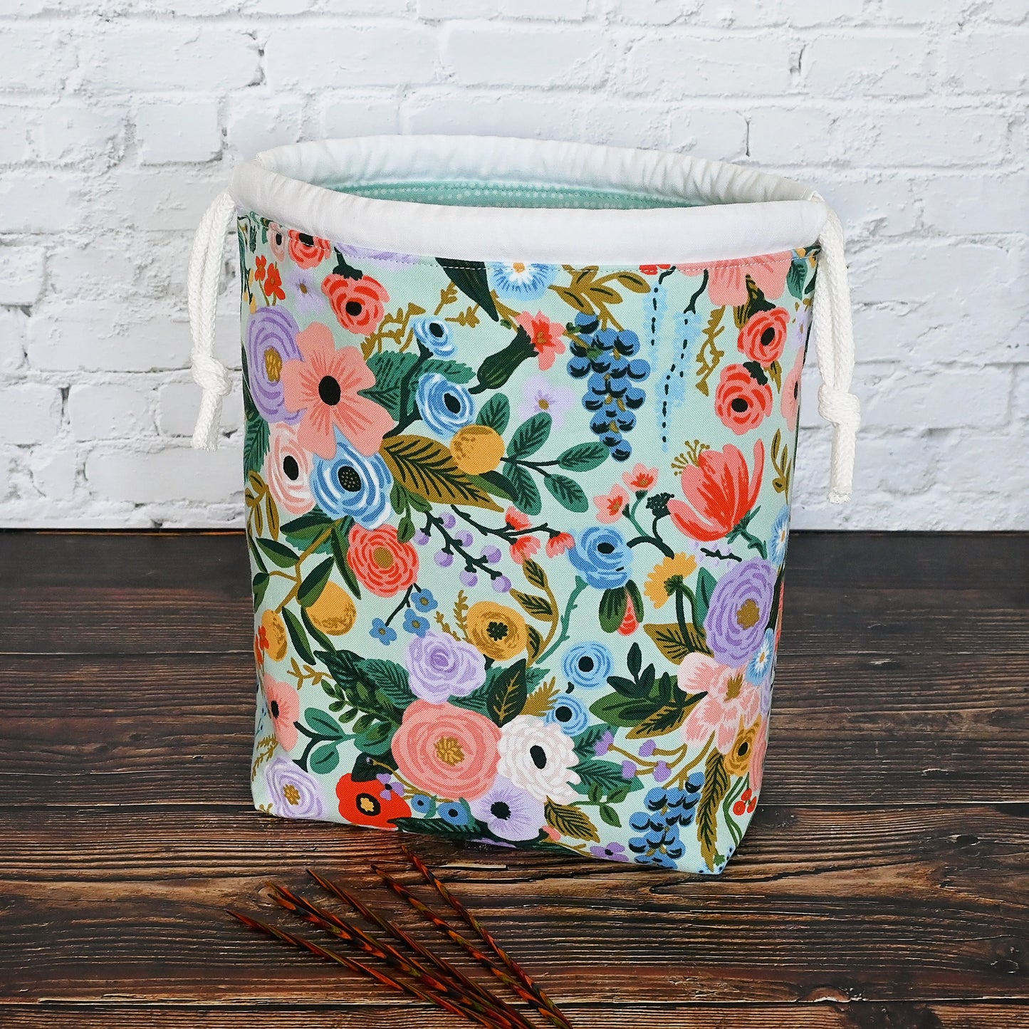 Pretty mint floral drawstring knitting bag made in a lovely cotton from Rifle Paper's newest Garden Party collection.  It's lined in a lovely spotted mint cotton and is available with or without pockets.  Closes securely with a double drawstring.  Made in Canada by Yellow Petal Handmade.