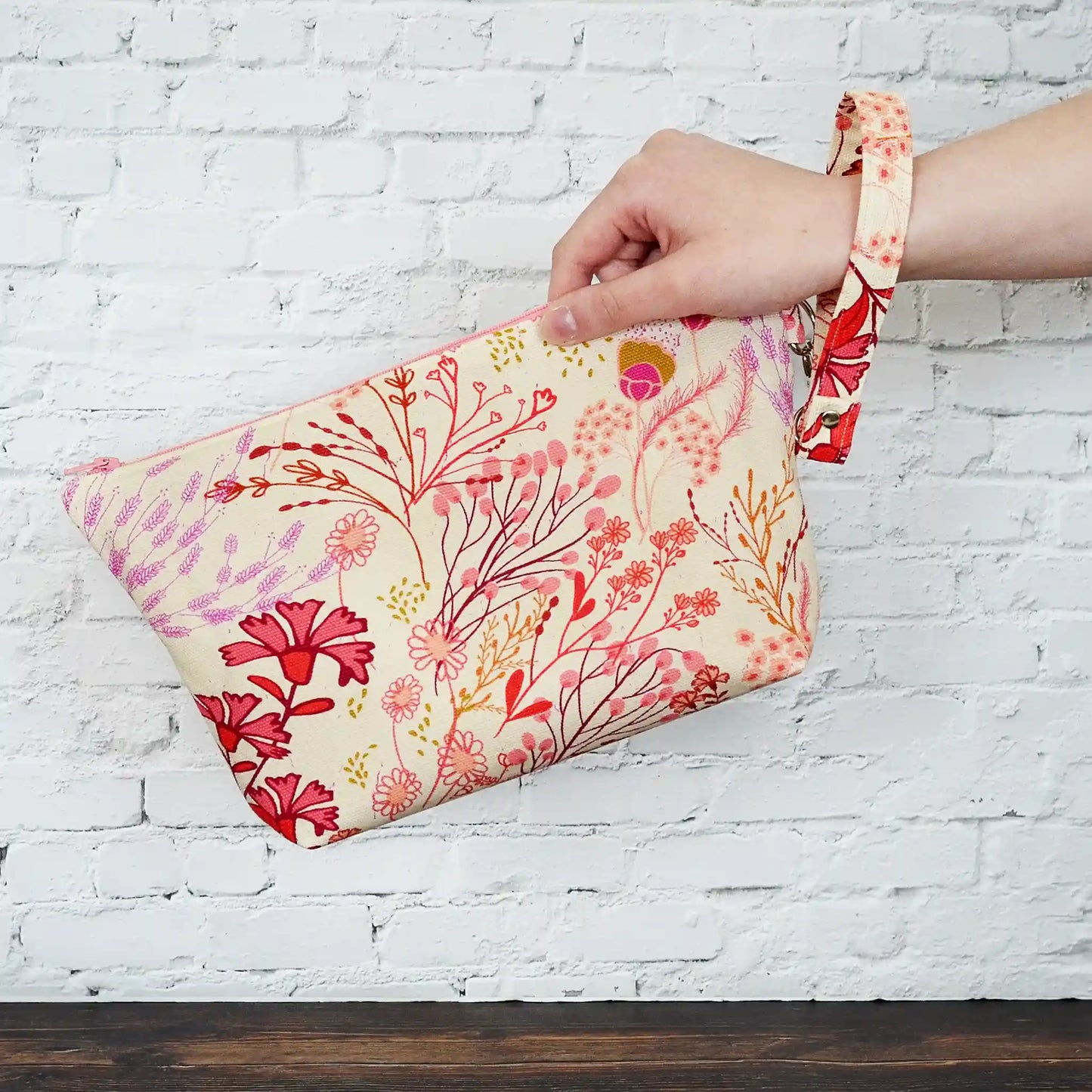 Small zippered project bag in floral canvas.  Comes with removable wrist strap.  Handmade in Nova Scotia, Canada.