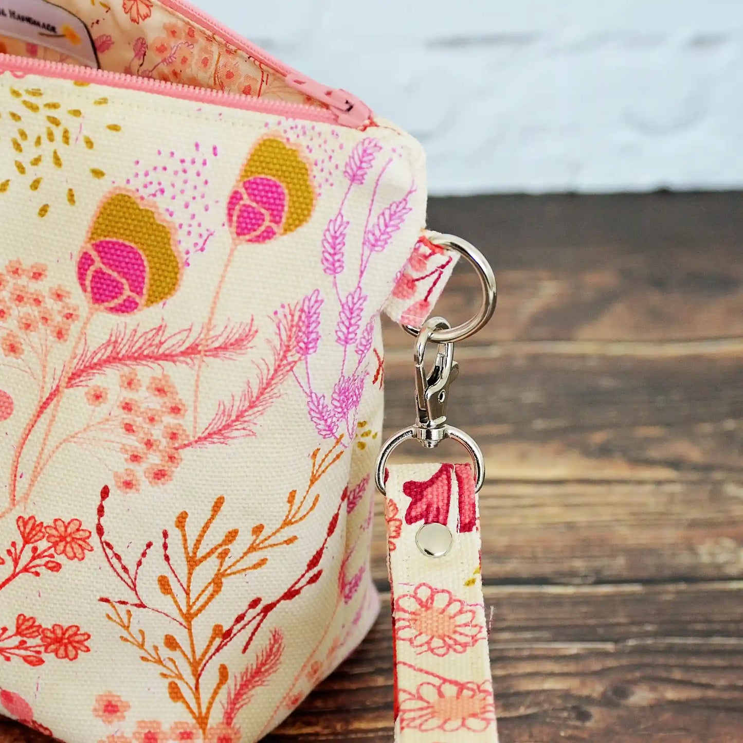 Small zippered project bag in floral canvas.  Comes with removable wrist strap.  Handmade in Nova Scotia, Canada.