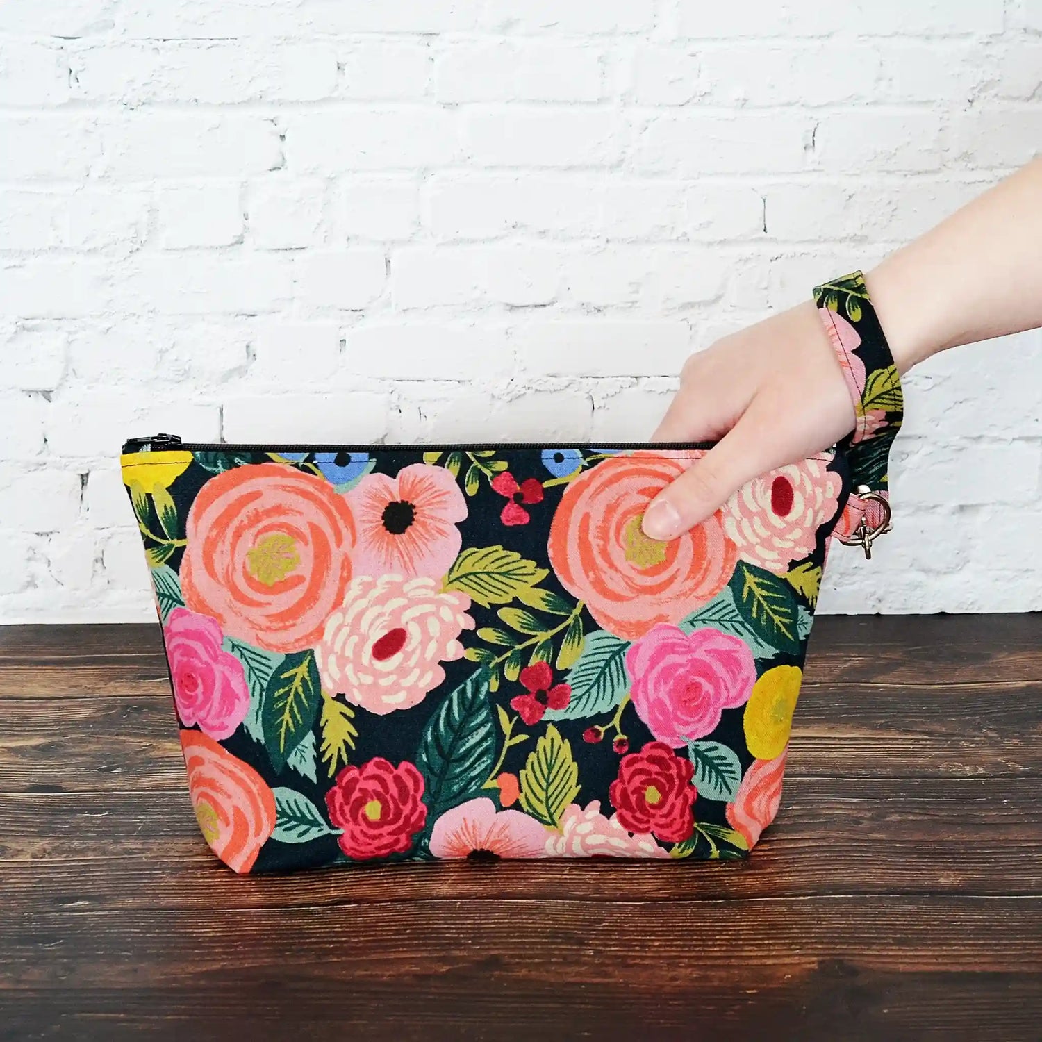 Canvas zippered project bag in a striking floral print with a black background.  Designed for small projects using Rifle Paper Co. fabric.  Made in Nova Scotia, Canada by Yellow Petal Handmade.