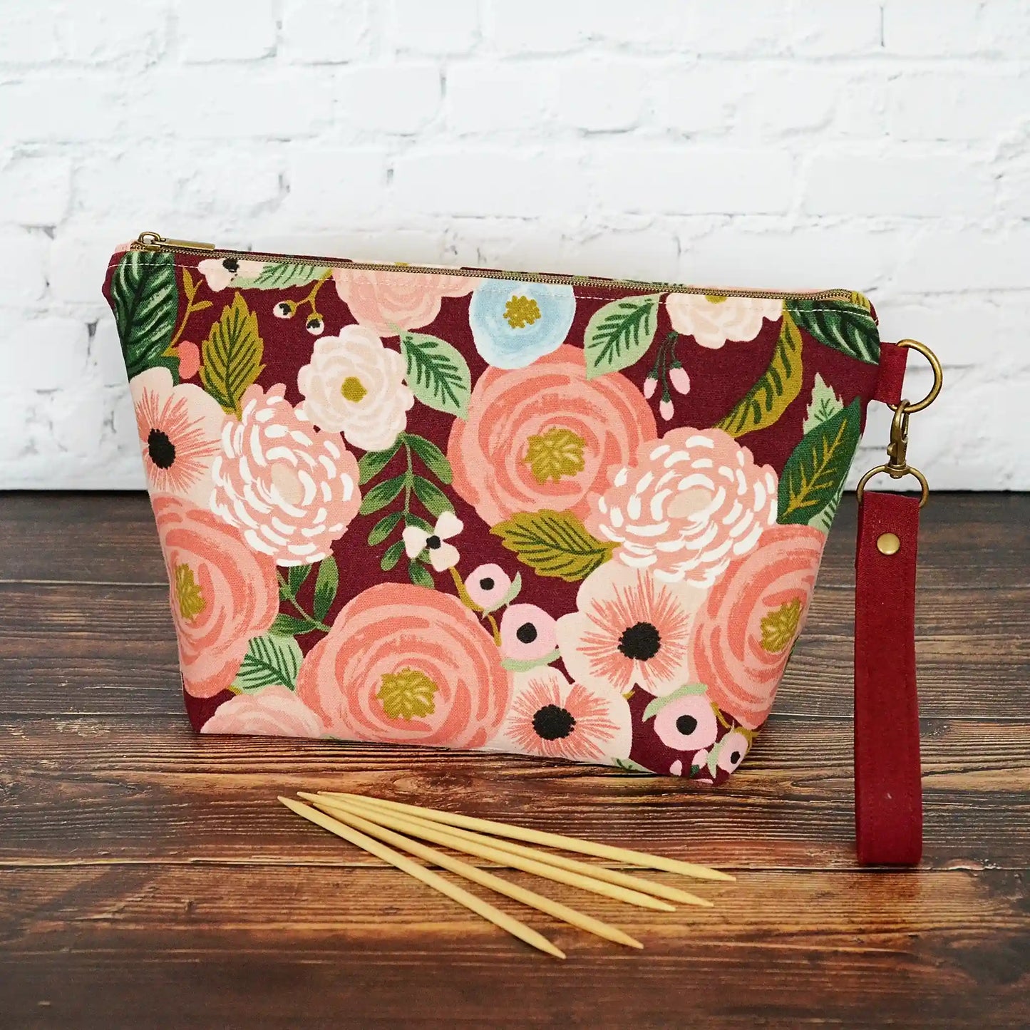 Burgundy floral canvas pouch with blush and metallic gold star lining.  Made in Canada by Yellow Petal Handmade.