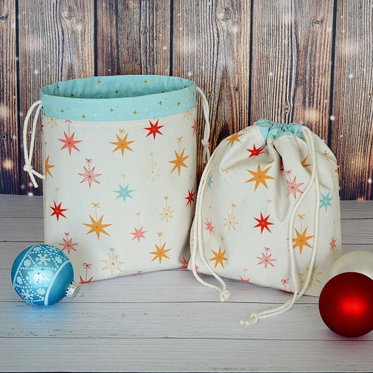 Pretty Christmas Stars bags with an aqua lining and gold accents.  Handmade in Canada.