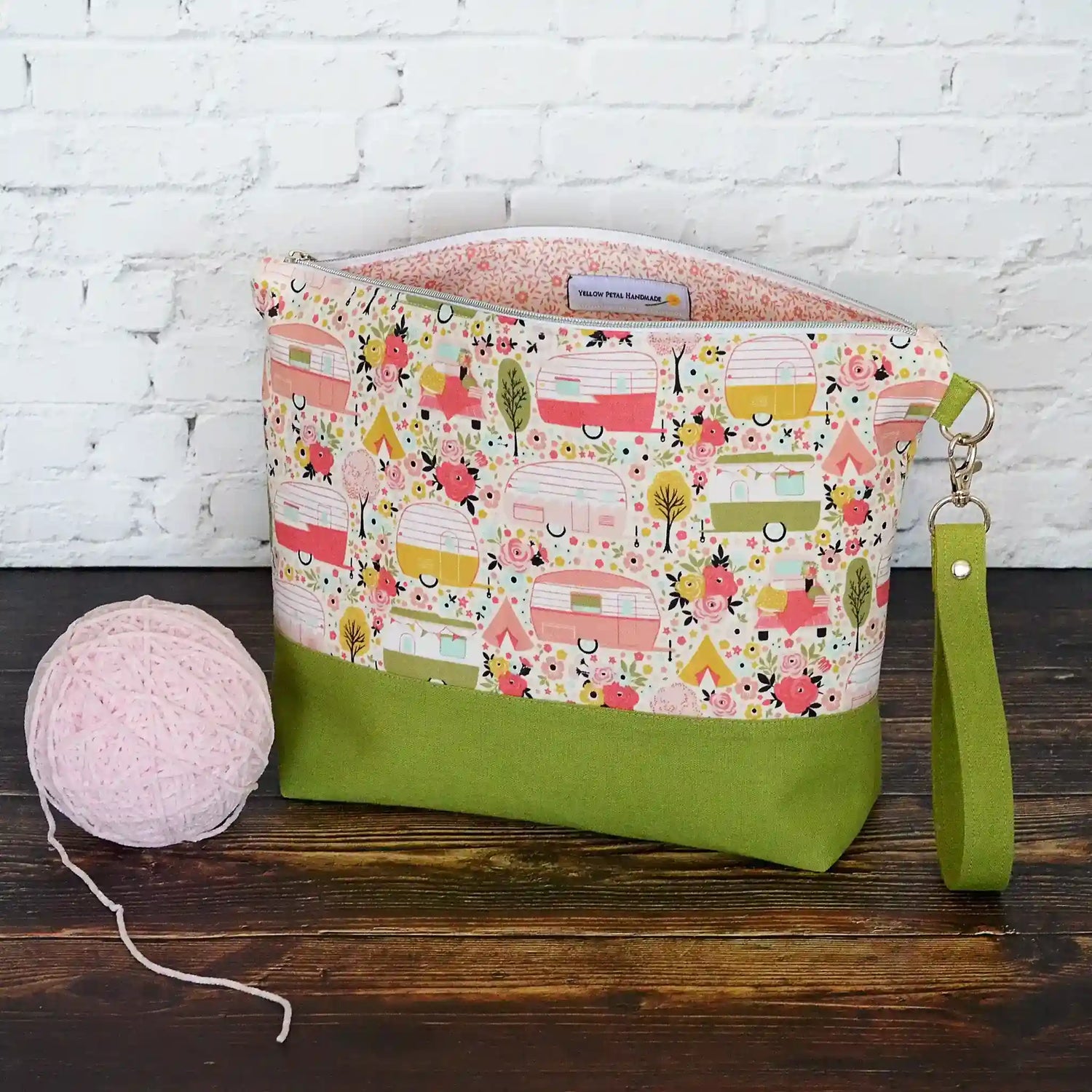 Vintage Camper themed project bag with zipper, pockets and a removable strap.  Paired with a lime green linen and lined in a pretty floral.  Made in Canada by Yellow Petal Handmade.