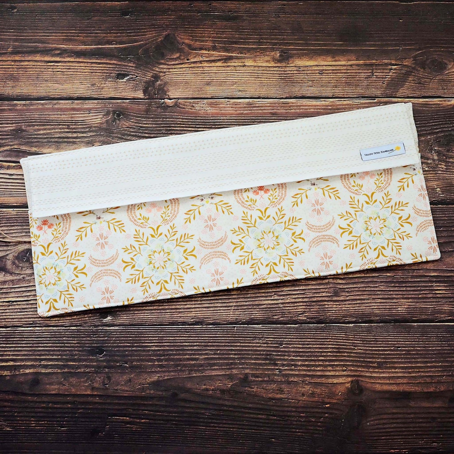 Quilted needle wrap in premium Art Gallery Fabric with a gorgeous cream, pink and gold geometric pattern.  Made in Canada by Yellow Petal Handmade.