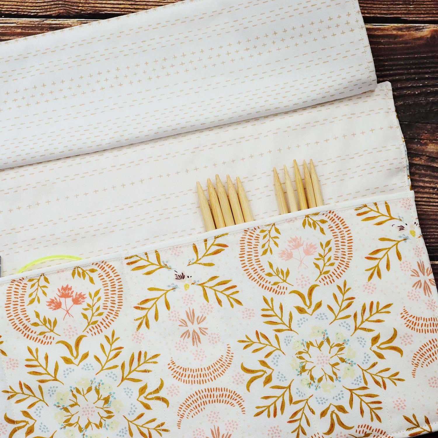Quilted needle wrap in premium Art Gallery Fabric with a gorgeous cream, pink and gold geometric pattern.  Made in Canada by Yellow Petal Handmade.