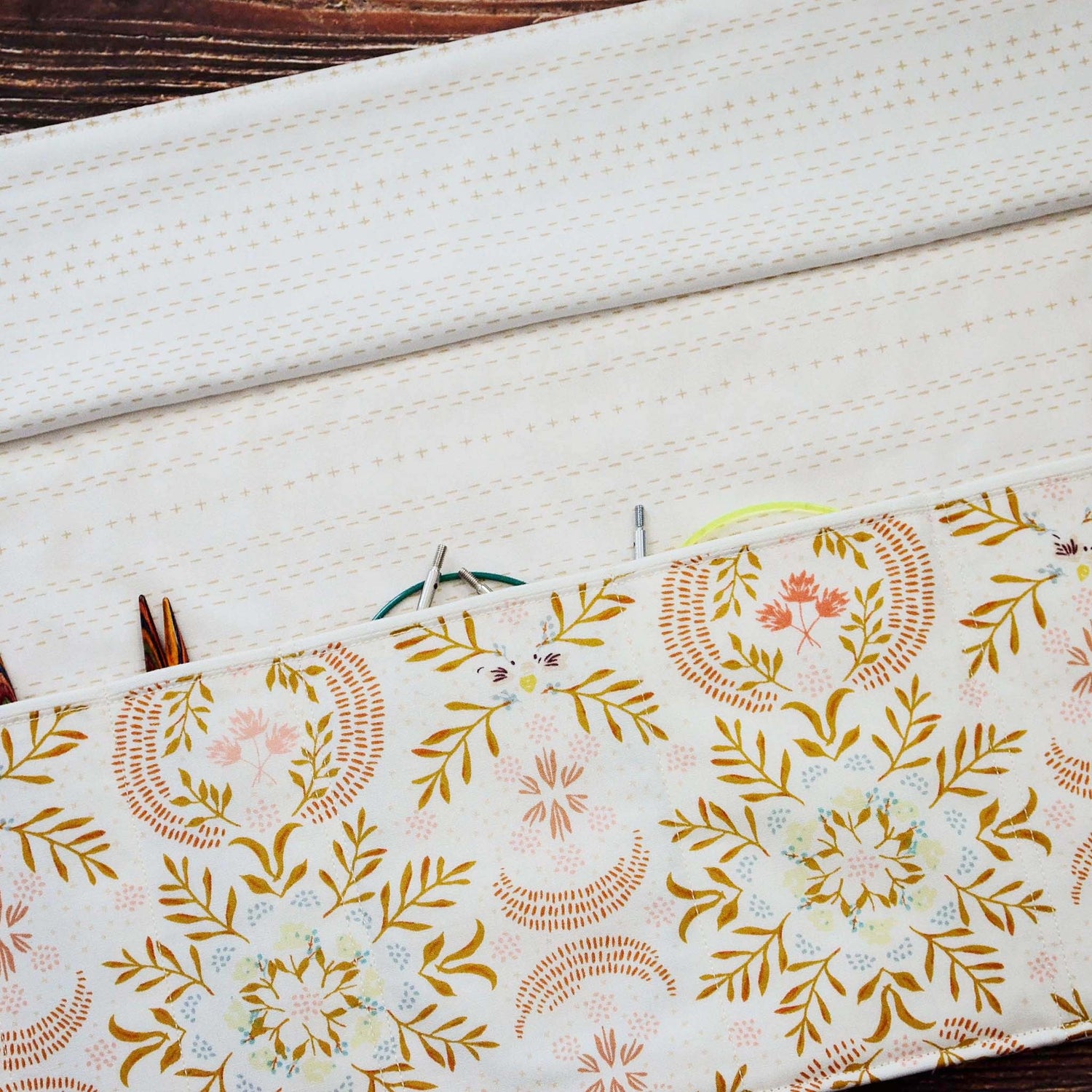 Quilted needle wrap in premium Art Gallery Fabric with a gorgeous cream, pink and gold geometric pattern.  Made in Canada by Yellow Petal Handmade.