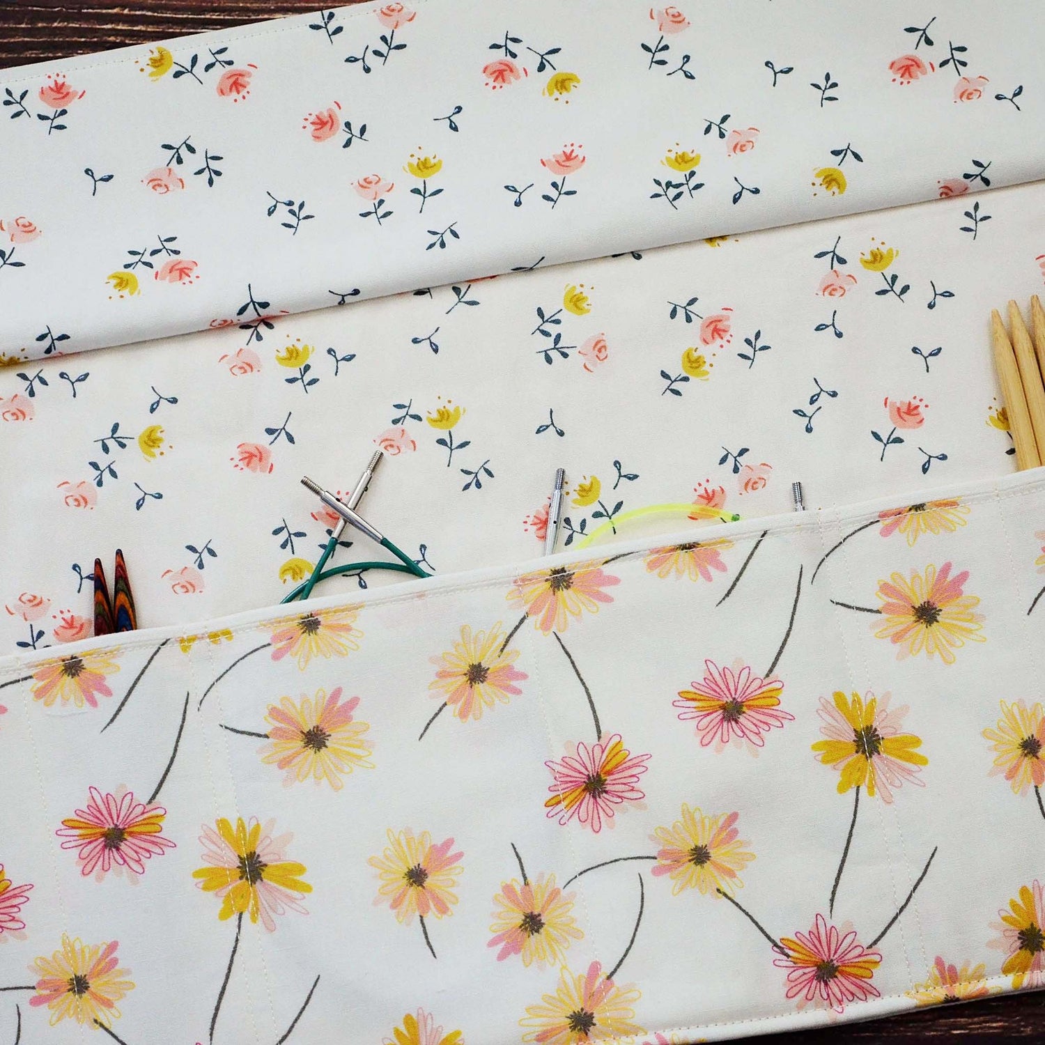 Quilted needle wrap in premium Art Gallery Fabric with a pretty pink and yellow daisy pattern.  Made in Canada by Yellow Petal Handmade.
