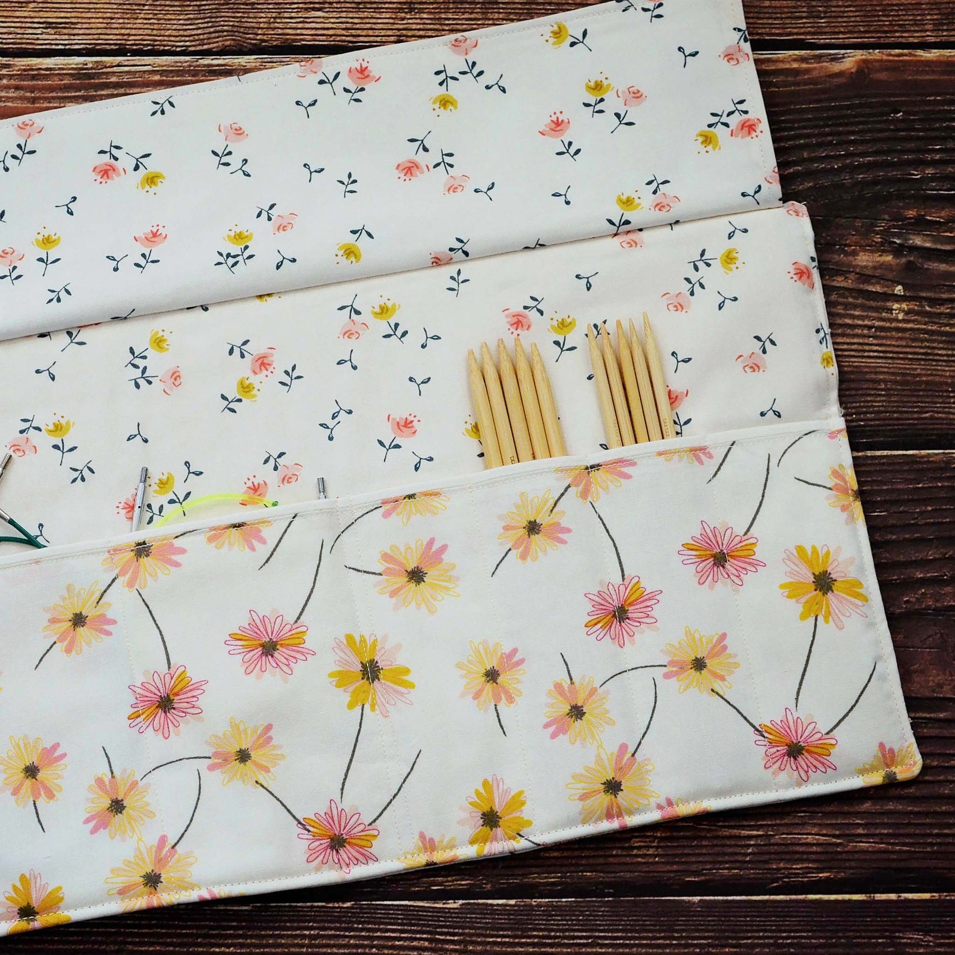 Quilted needle wrap in premium Art Gallery Fabric with a pretty pink and yellow daisy pattern.  Made in Canada by Yellow Petal Handmade.