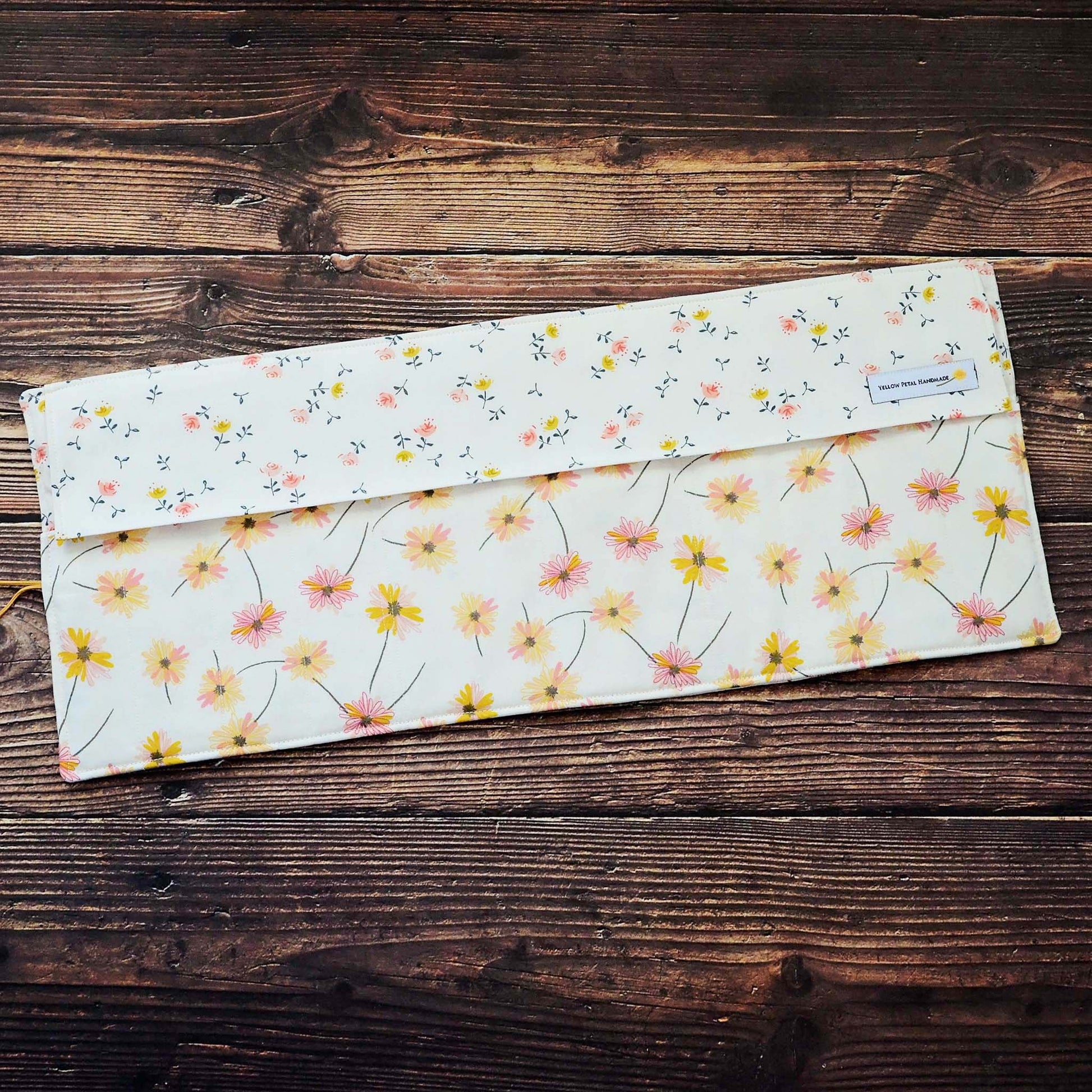 Quilted needle wrap in premium Art Gallery Fabric with a pretty pink and yellow daisy pattern.  Made in Canada by Yellow Petal Handmade.