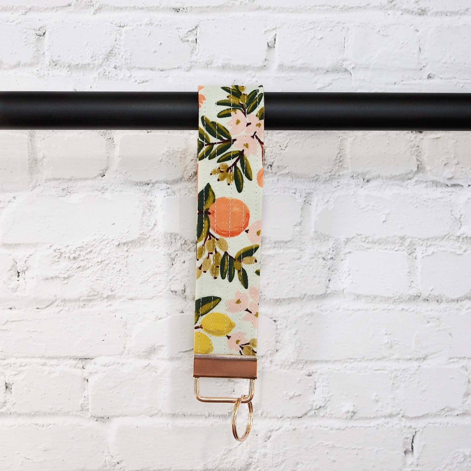 Keychain wristlets in Rifle Paper Co. fabrics and gold hardware.  Made in Canada by Yellow Petal Handmade.