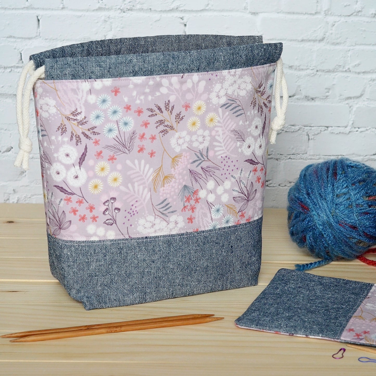 Mauve floral and indigo linen knitting project bag and pouch set.