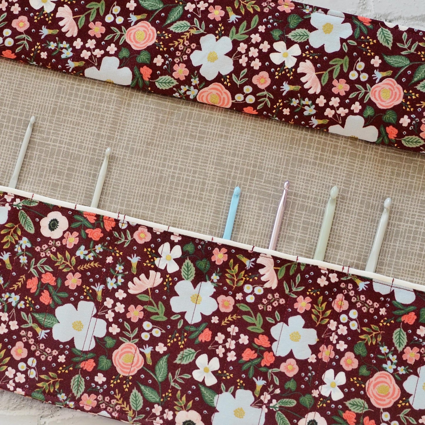 Quilted crochet hook wrap in burgundy floral Rifle Paper Co fabric.  Made in Canada by Yellow Petal Handmade.