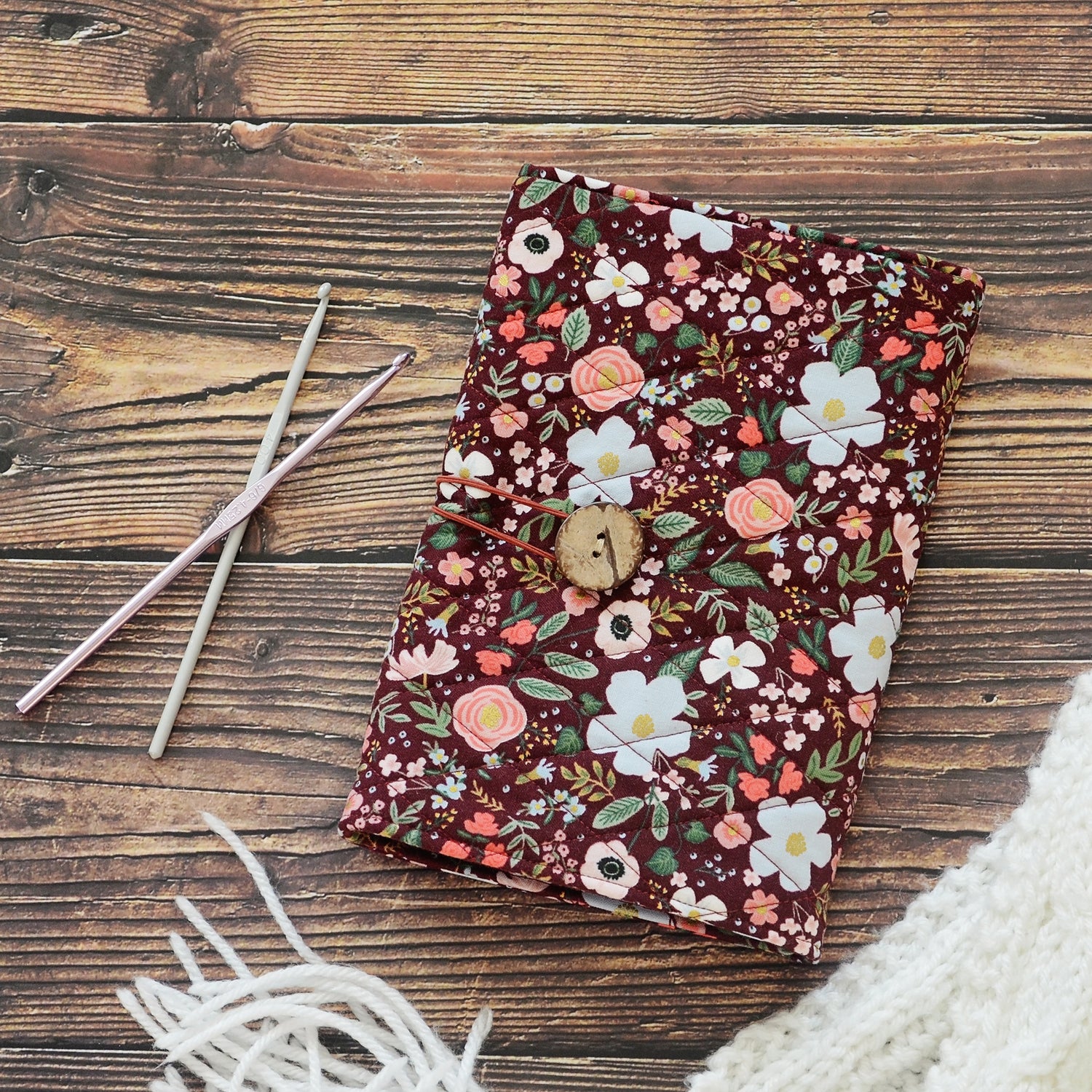 Quilted crochet hook wrap in burgundy floral Rifle Paper Co fabric.  Made in Canada by Yellow Petal Handmade.