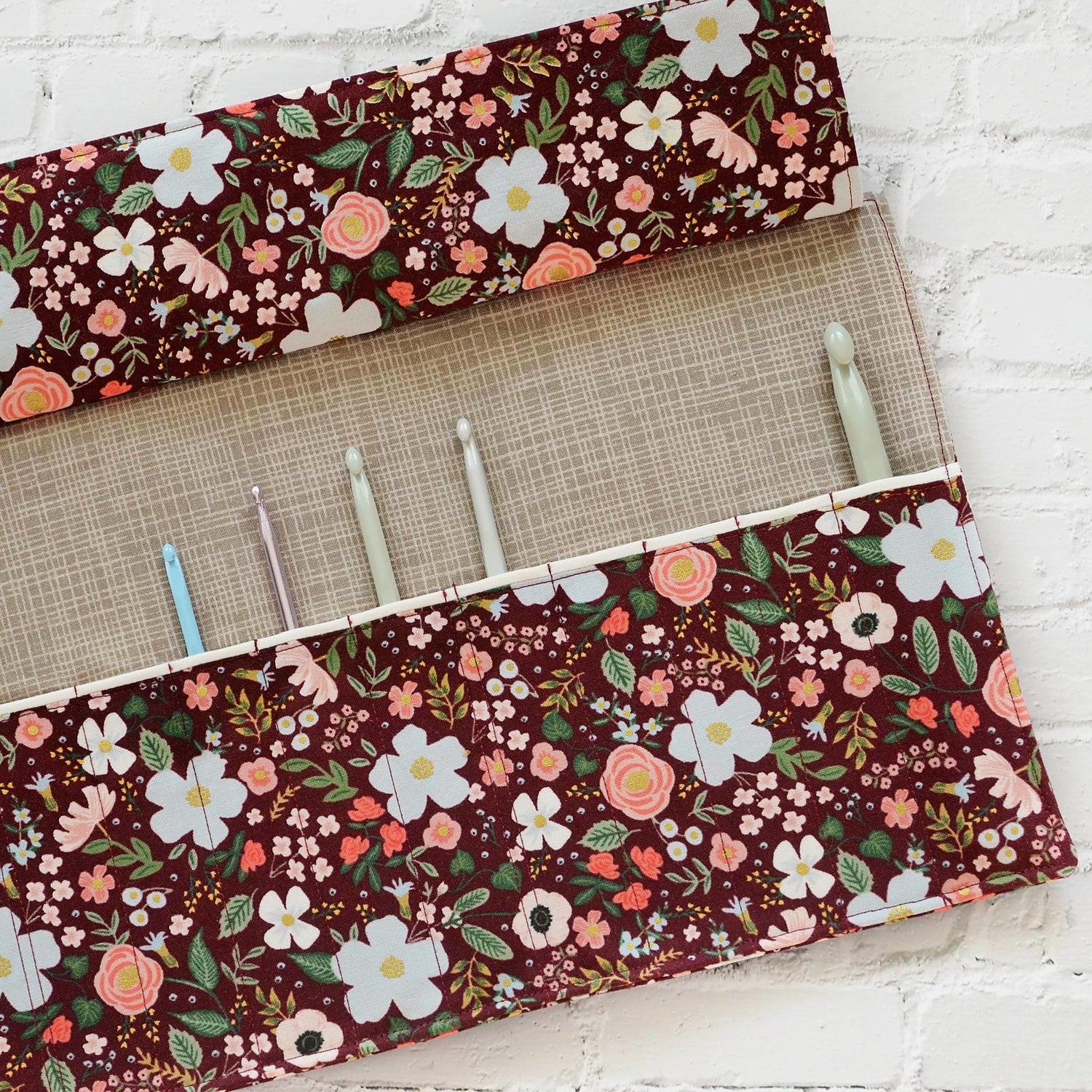 Quilted crochet hook wrap in burgundy floral Rifle Paper Co fabric.  Made in Canada by Yellow Petal Handmade.