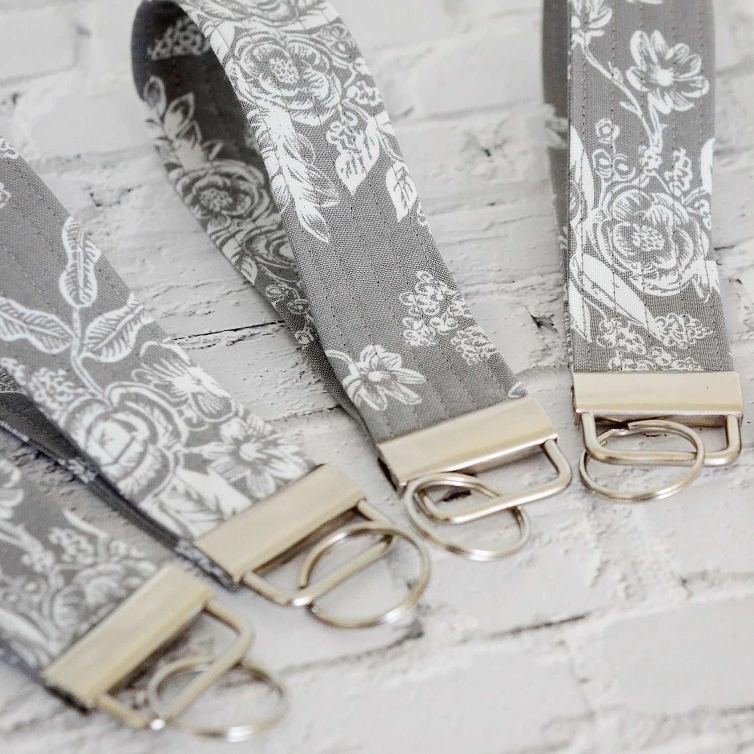 Keychain wristlets in Rifle Paper Co. fabrics and gold hardware.  Made in Canada by Yellow Petal Handmade.