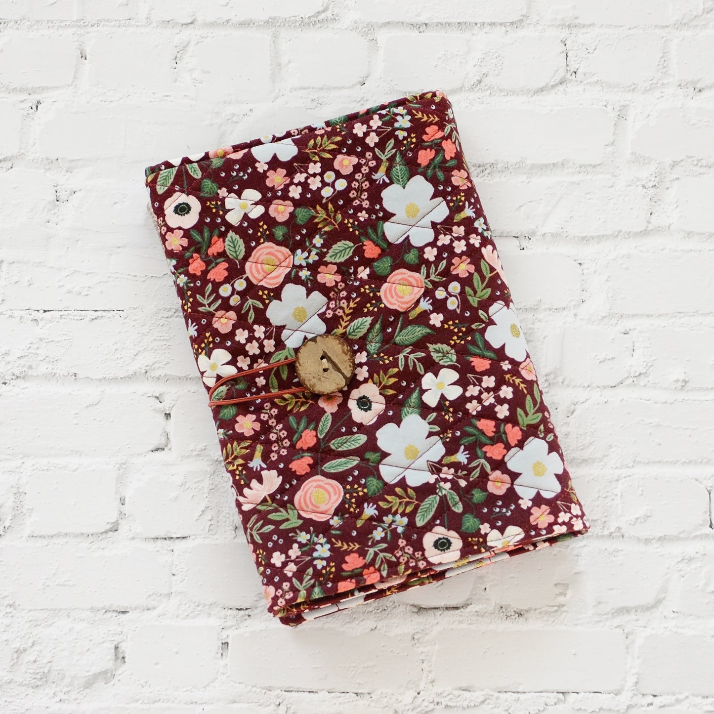 Quilted crochet hook wrap in burgundy floral Rifle Paper Co fabric.  Made in Canada by Yellow Petal Handmade.