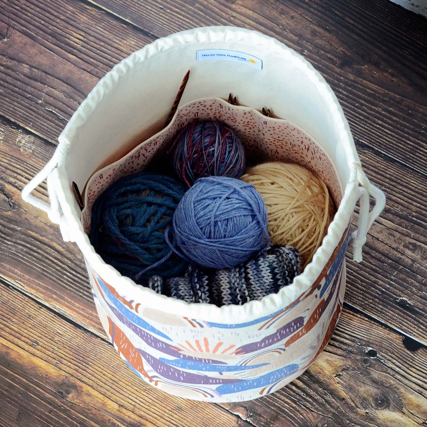 Rainbow knitting bag in canvas with multiple pockets  Handmade in Nova Scotia, Canada by Yellow Petal Handmade.