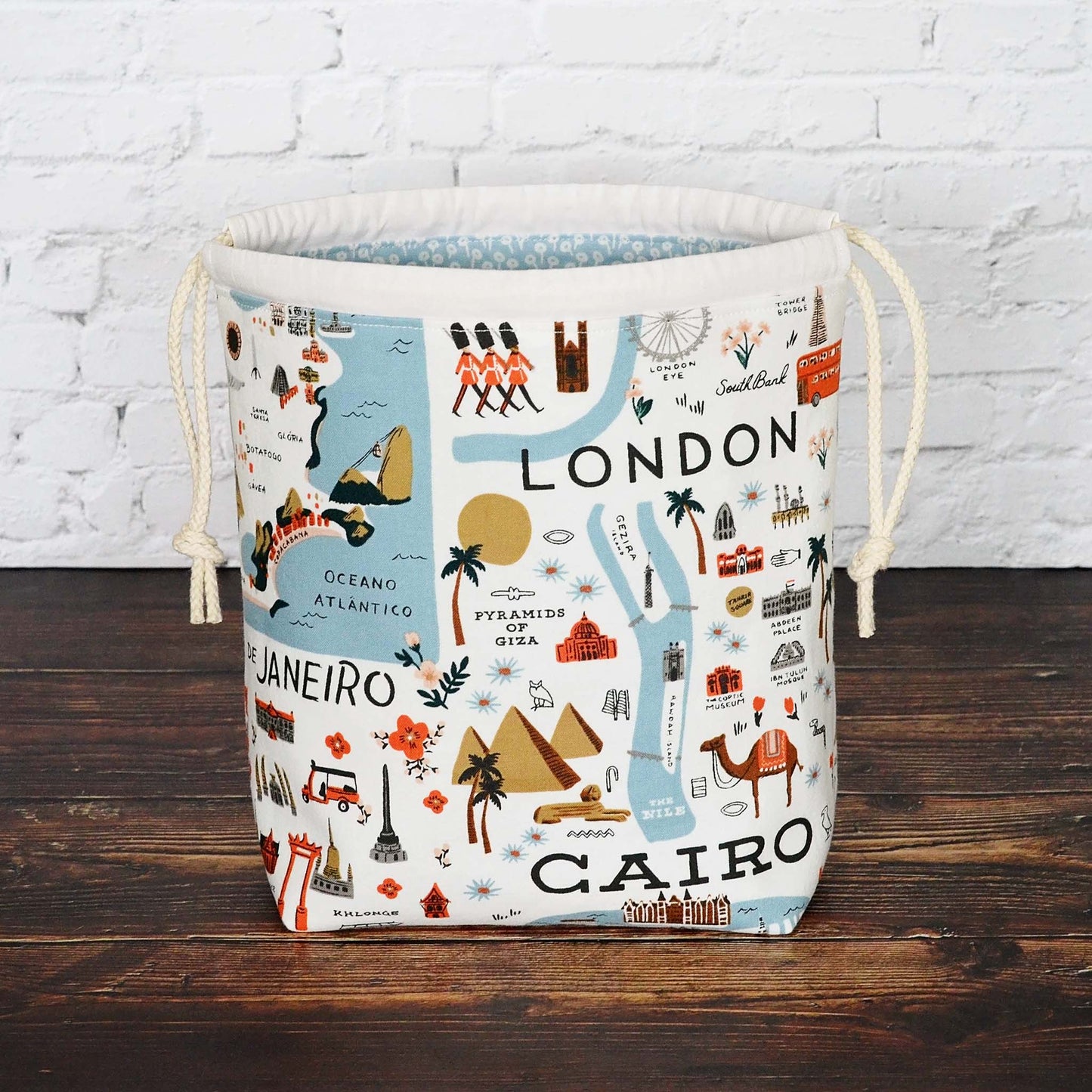 Small drawstring sock knitting bag in pretty travel fabric from the Bon Voyage collection by Rifle Paper Co.  Made in Canada by Yellow Petal Handmade.