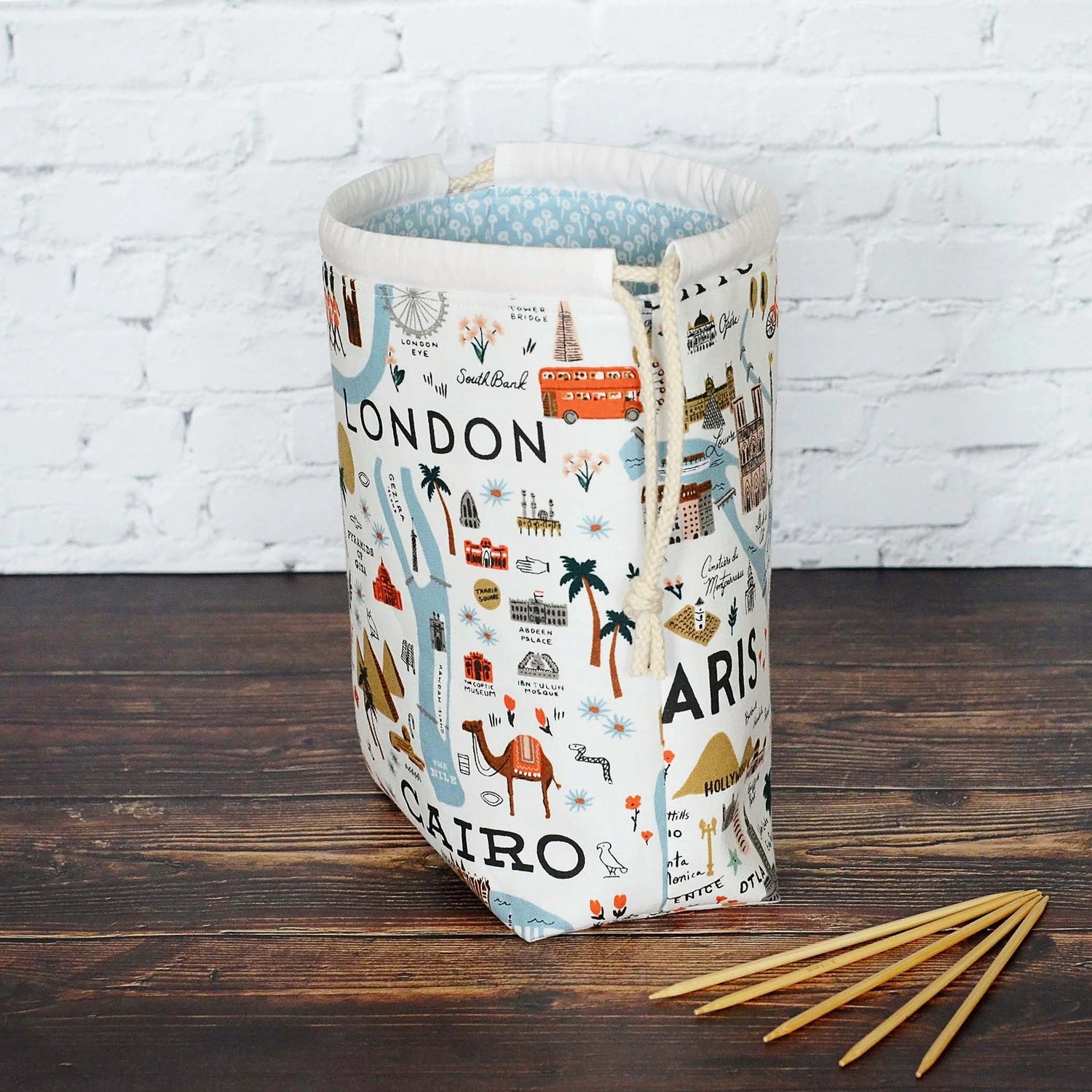 Small drawstring sock knitting bag in pretty travel fabric from the Bon Voyage collection by Rifle Paper Co.  Made in Canada by Yellow Petal Handmade.